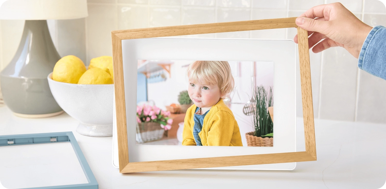 Frame 2 with photo of a young girl in a yellow jacket with a snap frame