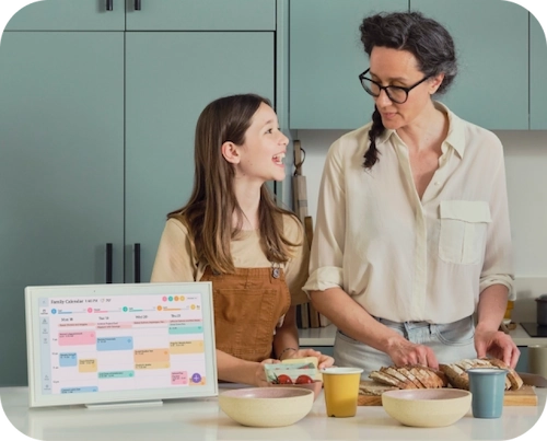 Mom and daughter in the kitchen making a meal following Skylight Calendar's meal planning feature