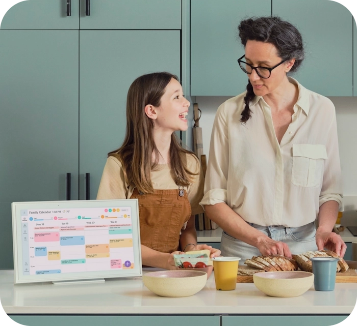 Mom and daughter in the kitchen making a meal following Skylight Calendar's meal planning feature