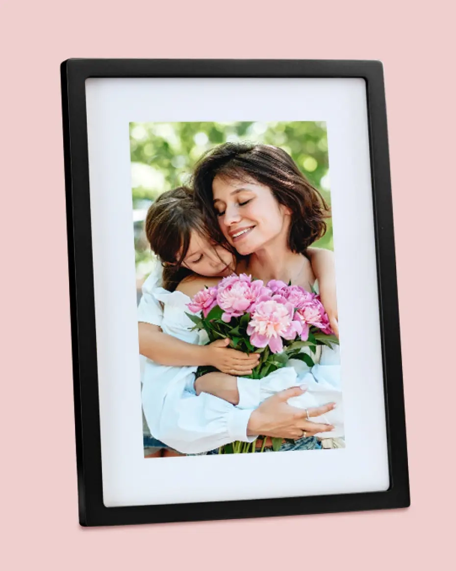 Skylight Frame shown on portrait with a mom and child embracing with pink flowers